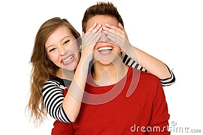 Woman covering boyfriendâ€™s eyes Stock Photo